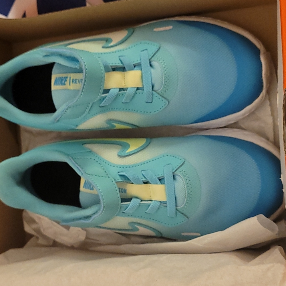 Kids sneakers. Nike brand teal and lime green size 1.5
